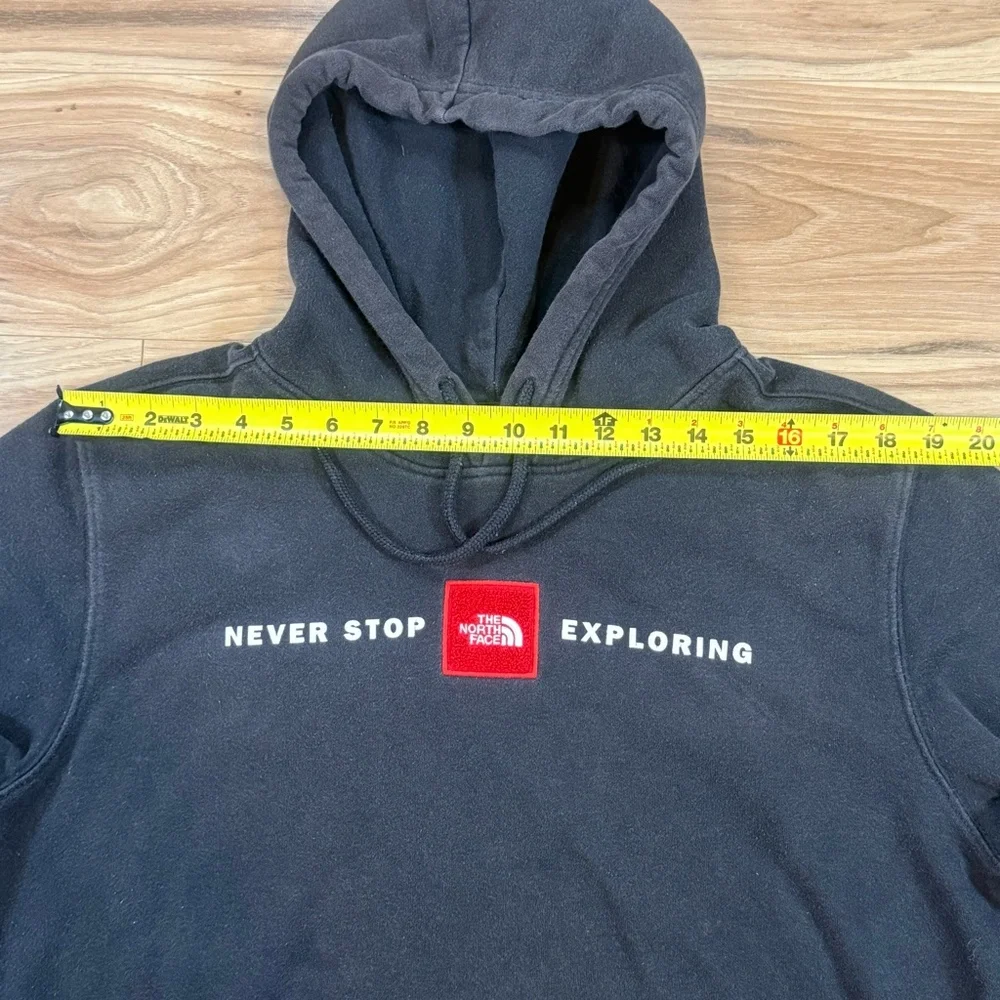 The North Face Black Hoodie with Red Logo Patch